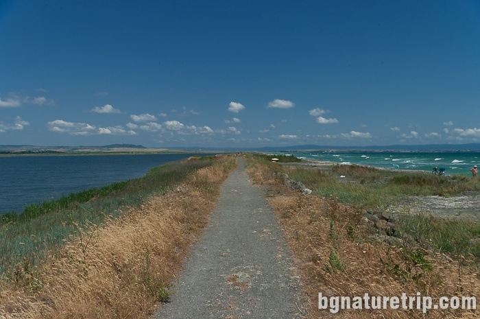 The path along the embankment at the sand strip of Pomorie Lake to the town of Aheloy